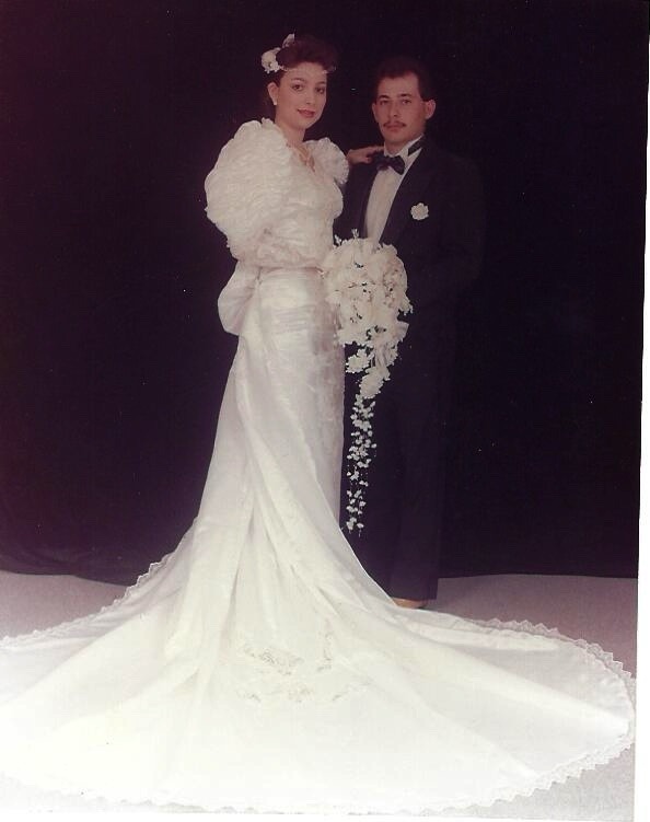 Ramon and Gracie in a full-length studio portrait on their wedding day, 1991.